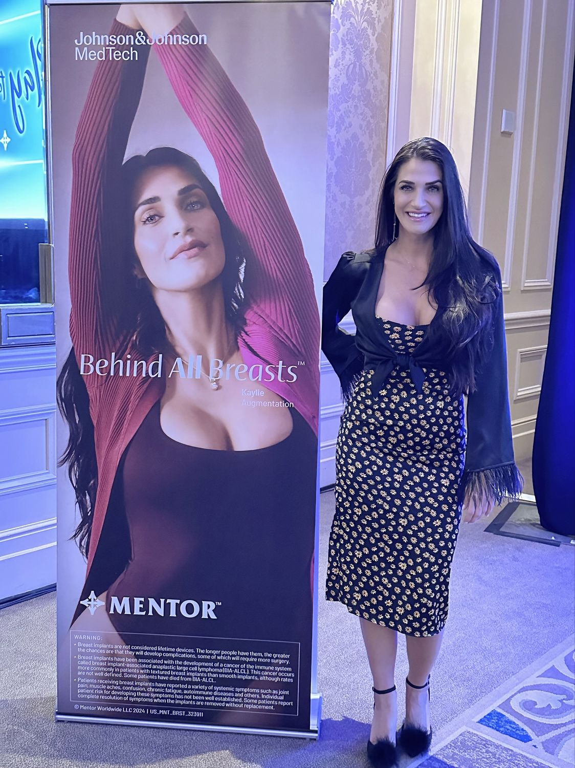Person with dog on a rocky outdoor landscape.