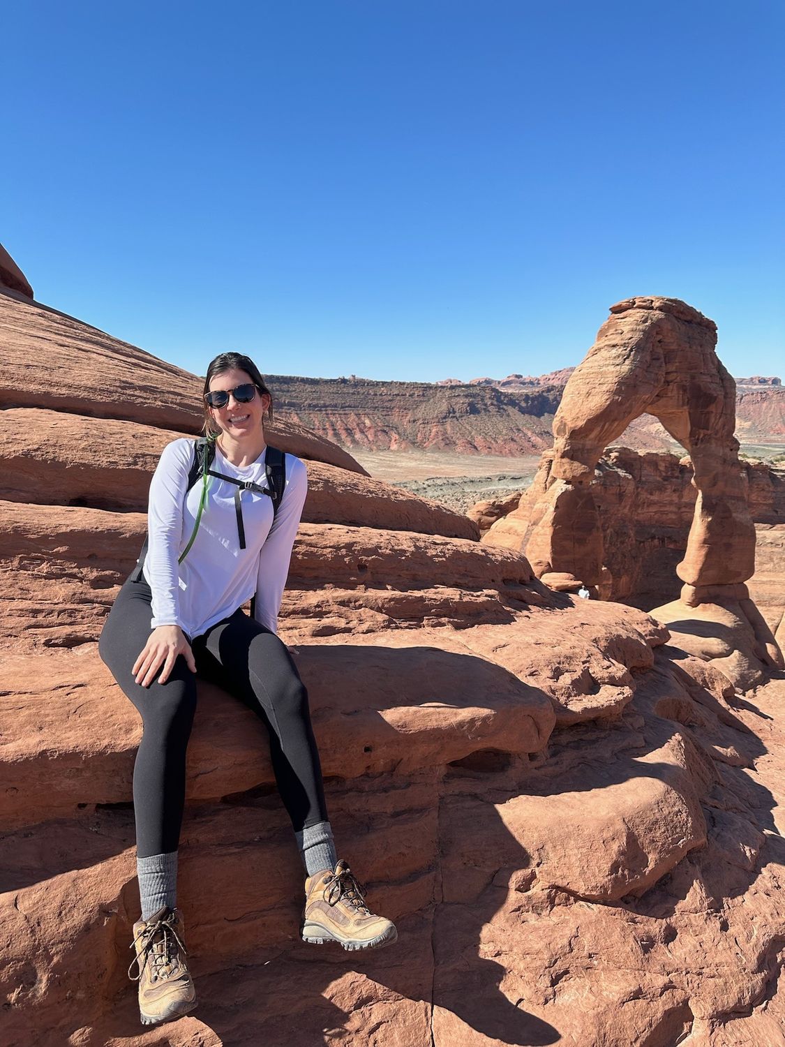 Family portrait with children against elegant backdrop.