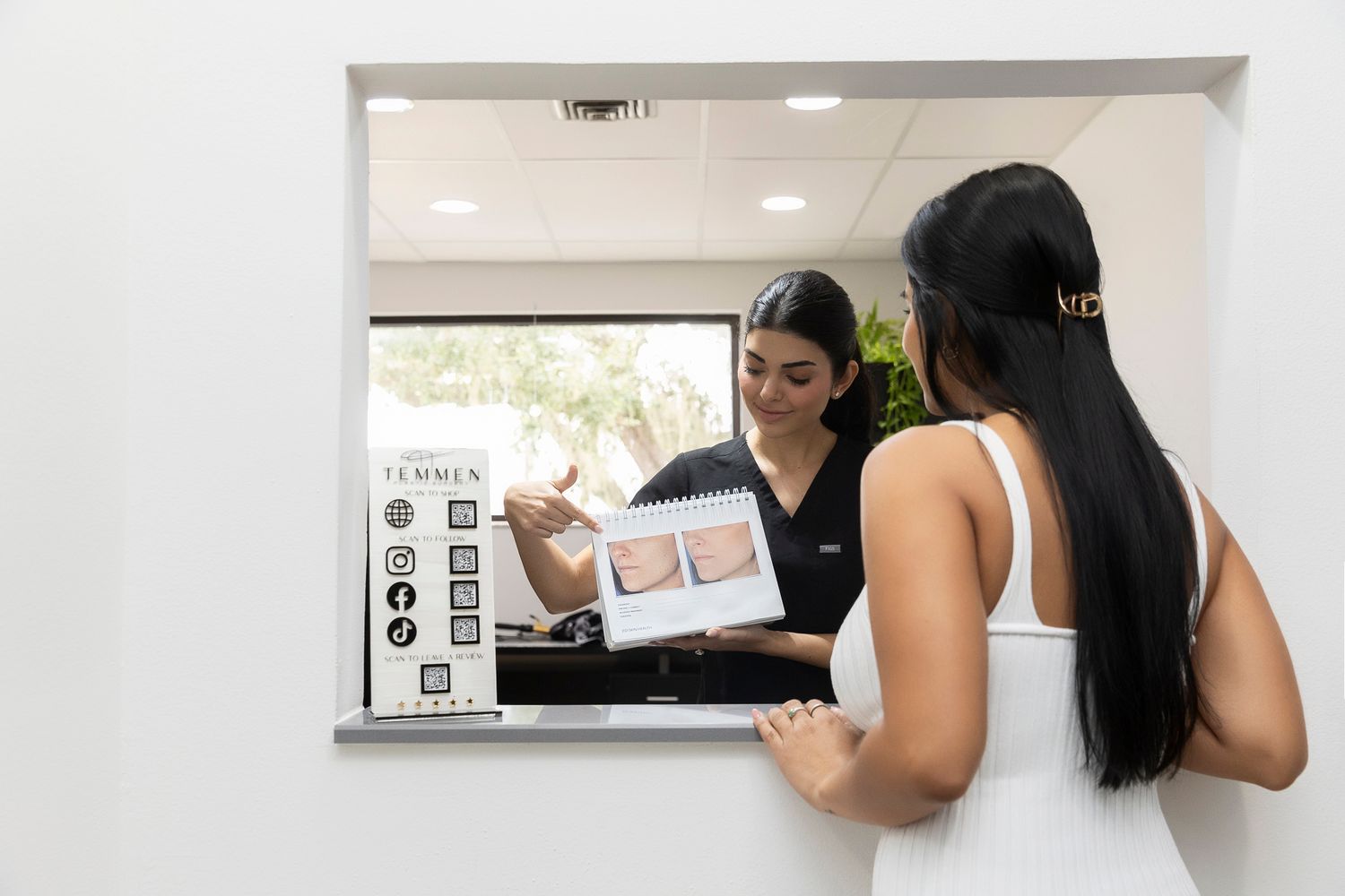 Consultation about botox treatment with client.